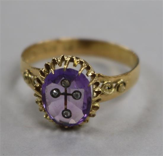 A Victorian 22ct gold, amethyst and diamond set ring, with inset cross motif (possible adaption?), size Q.